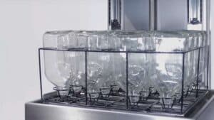 Clear glass bottles in a washing basket