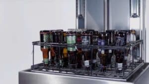 Brown beer bottles in a washing basket