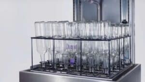 Glass water bottles in a washing basket