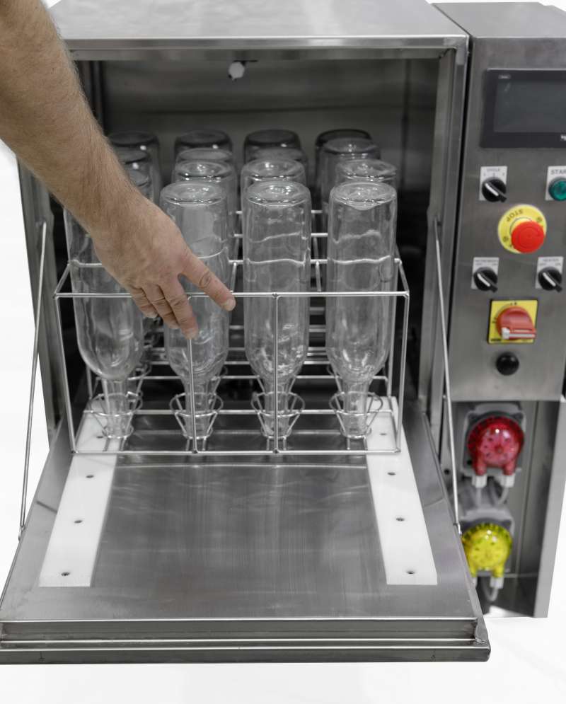 bottle cleaning sanitizing and sterilizing machine with wine bottles