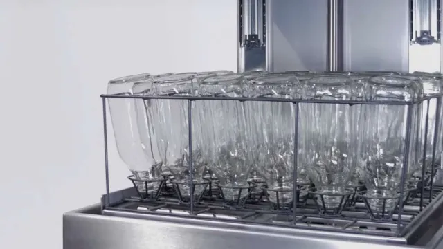 Milk bottles loaded in the basket of a milk bottle washer